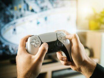 person holding black game controller