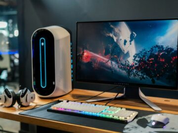 black flat screen computer monitor beside white computer keyboard