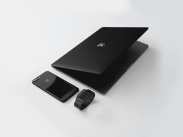 black Macbook near black iPhone 7 Plus and black Apple Watch