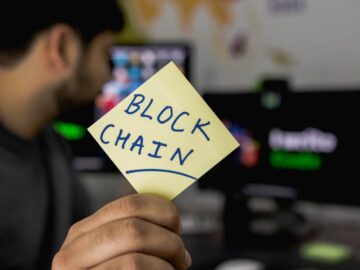 person holding sticky note