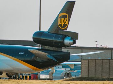 a large jetliner sitting on top of an airport tarmac