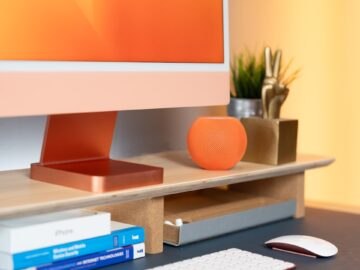 a computer monitor sitting on top of a desk