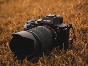 a camera sitting in the middle of a field