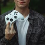 a person holding a video game controller