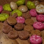 A wooden table topped with different types of cookies