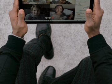 person holding black tablet Surface