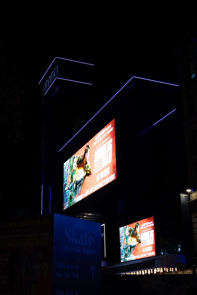 Modern building with illuminated screens at night