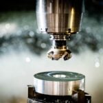 a machine that is cutting a piece of metal