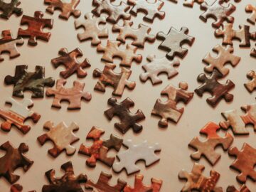 a large group of puzzle pieces sitting on top of a table