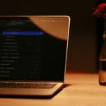 macbook pro on brown wooden table