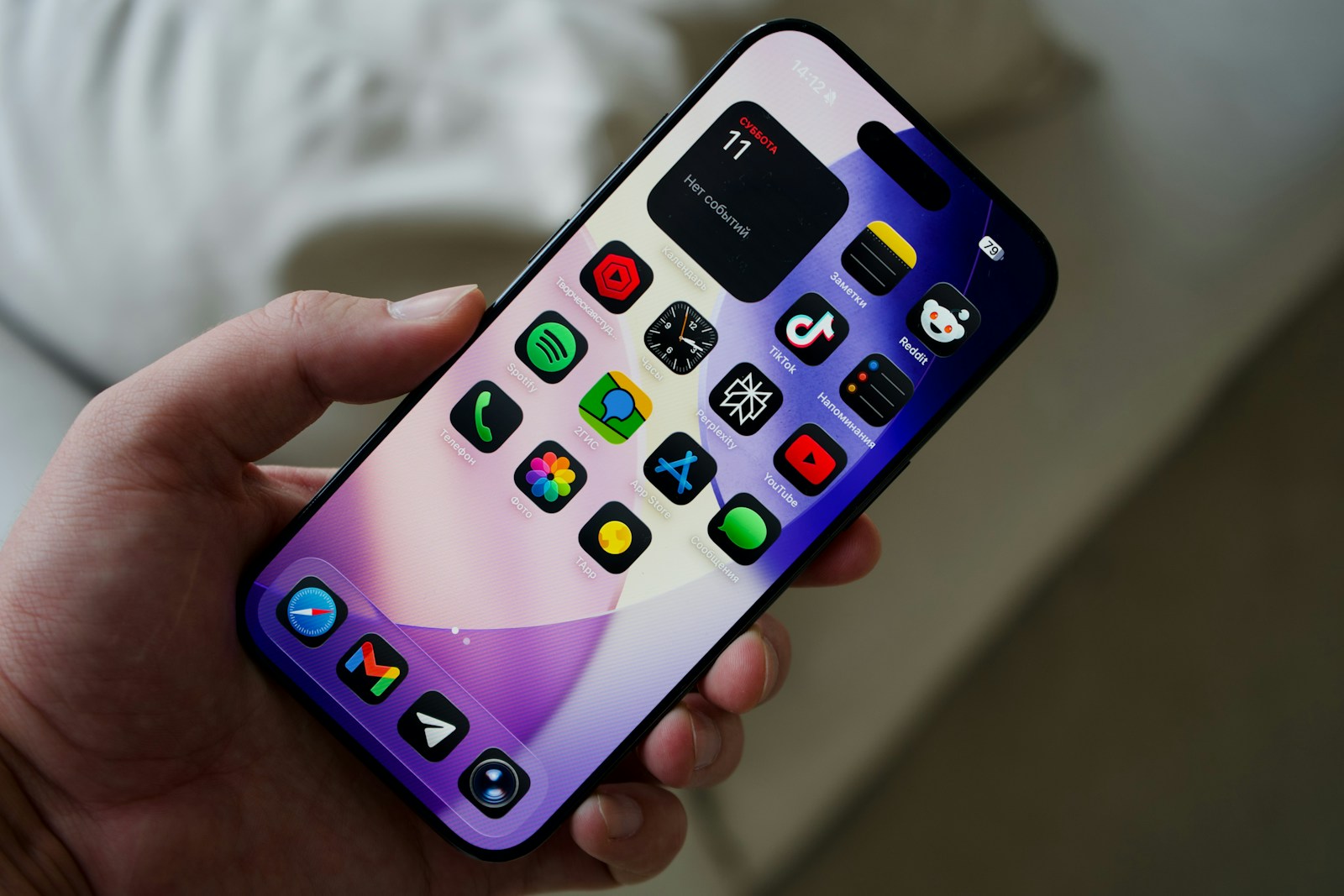 Discover What Makes Sohohindipro net Stand Out Online 5 Hand holding a smartphone with colorful app icons.