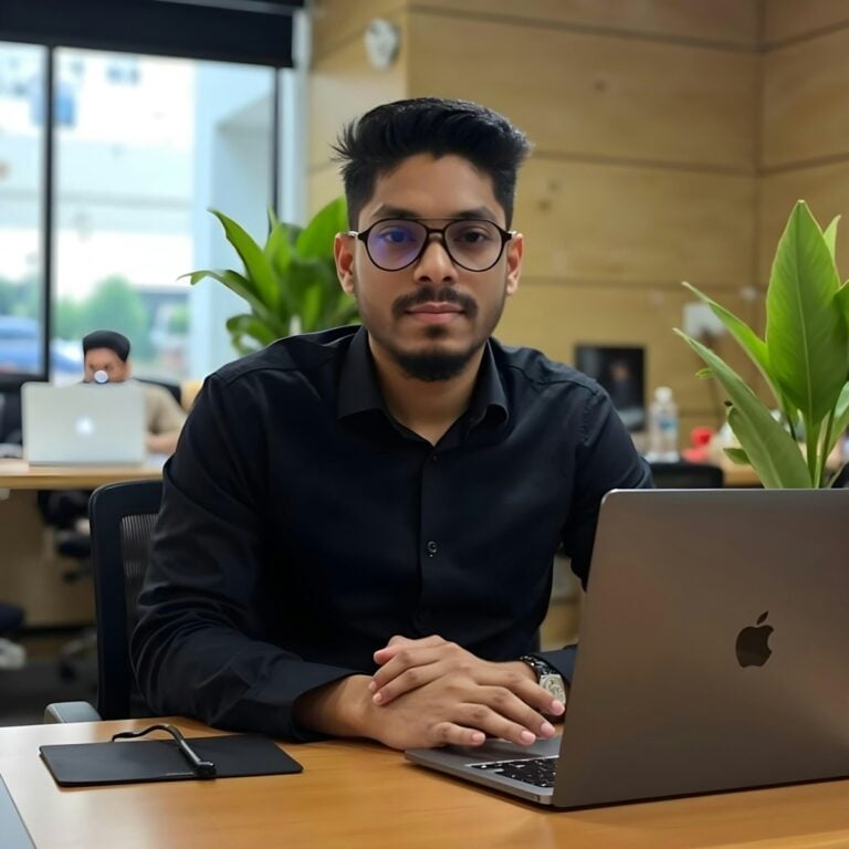 A man is working on his laptop.