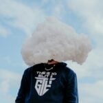 a person with a cloud on their head