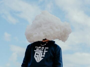 a person with a cloud on their head