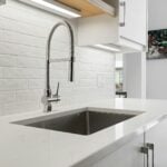 a kitchen with a sink and a window