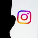 Instagram logo displayed on a smartphone screen.