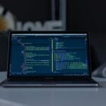 turned-on grey laptop computer