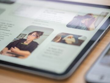 A tablet displaying a website with text and images