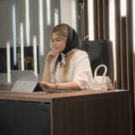 a woman sitting at a desk